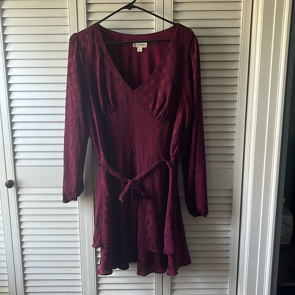 Women’s large mini flow dress, v neckline, two layer bottom to accent any figure